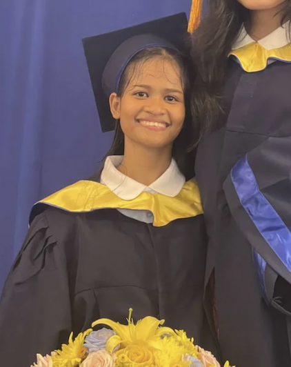 Chanra Hun in cap and gown at her graduation